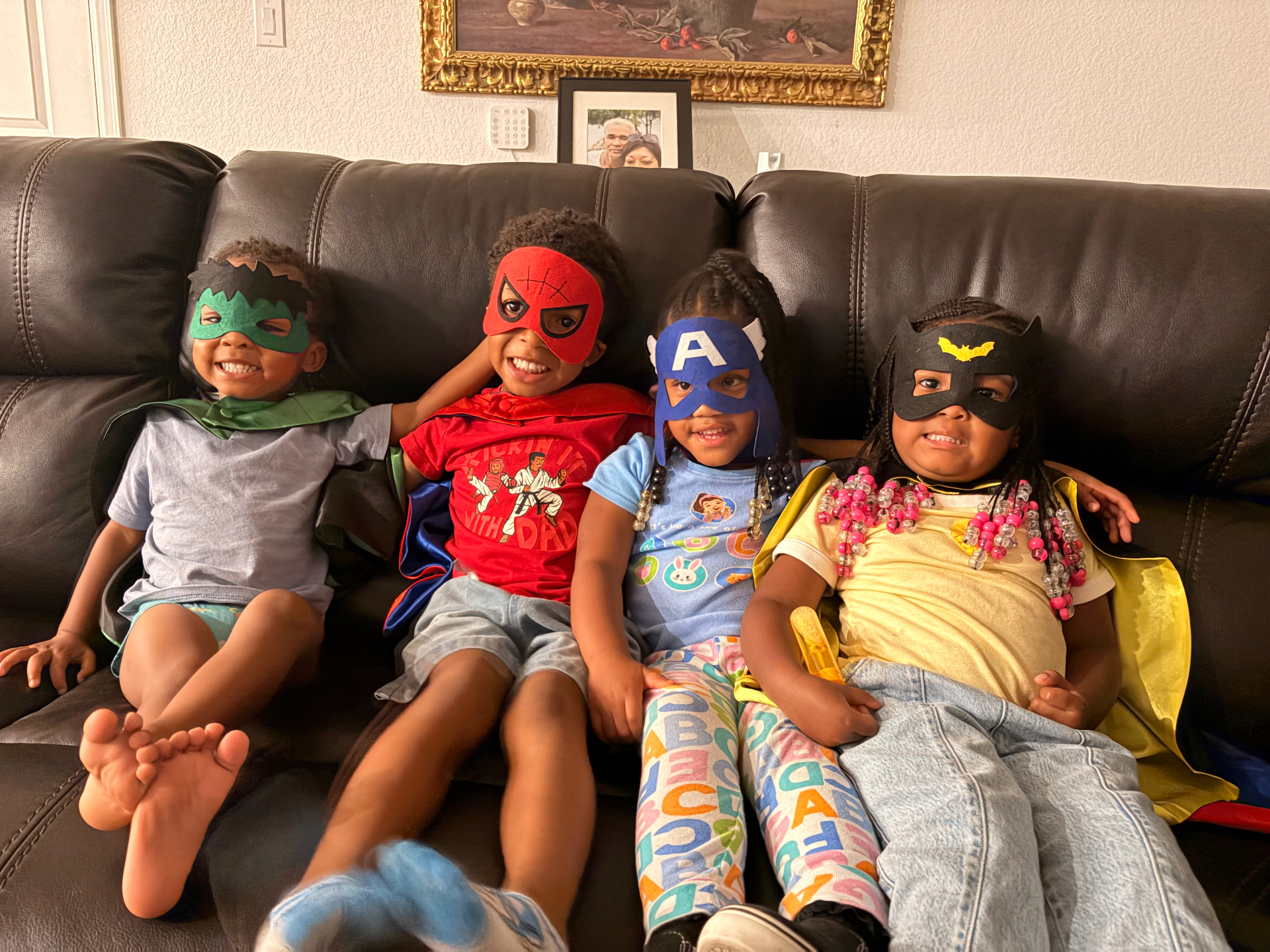 Children in superhero masks and capes enjoying a Parents Night Out dress-up party
